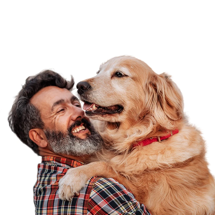 middle aged white man holding a very large happy golden retriever